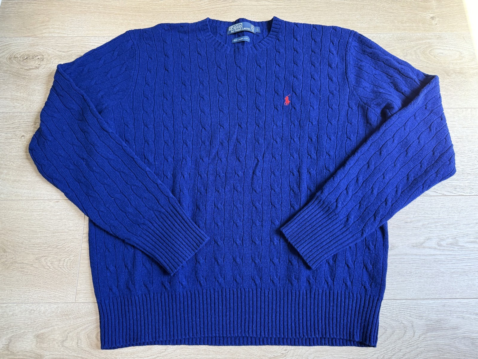 Royal blue cable-knit crewneck sweater with embroidered Polo pony