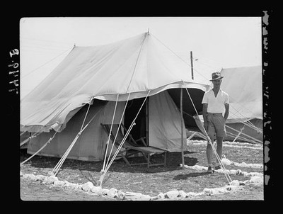 I.P.C. [i.e., Iraq Petroleum Company] camp. A camp manager outside his tent