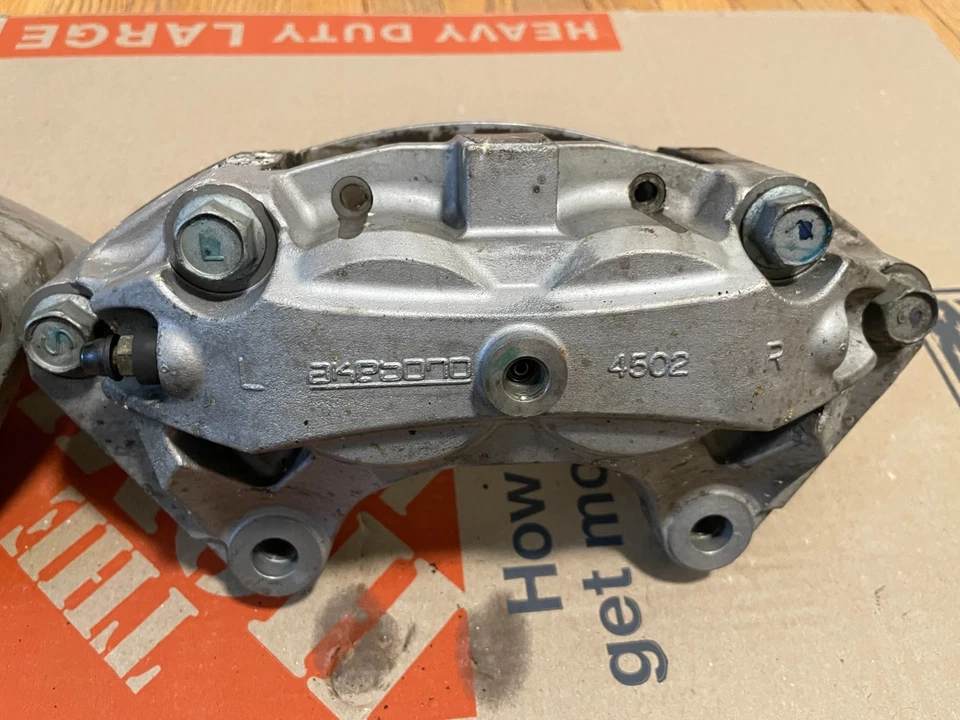 Infiniti G37/Q50/Q60 Akebono OEM Front & Rear Calipers Set 4502 & 4101 - Image 4 of 4