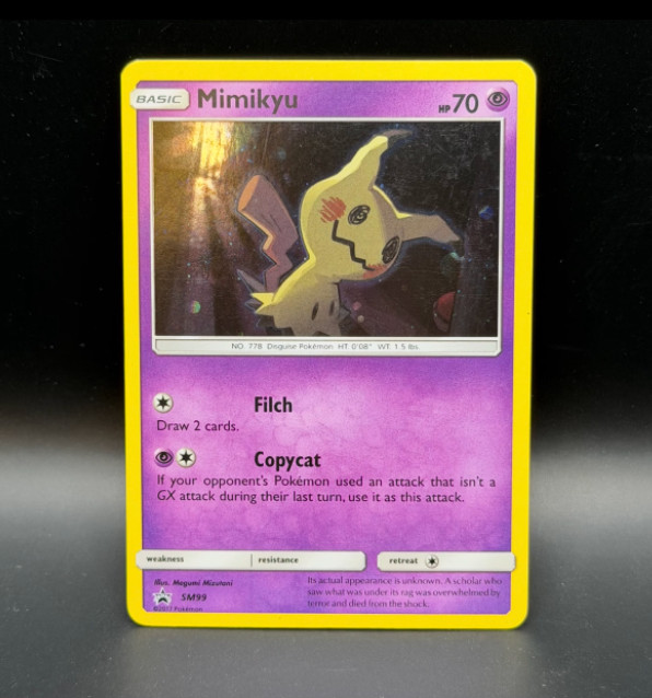 Mimikyu SM Black Star Promos SM99 Holo EN 2017 MP - Moderate Play