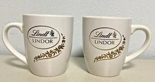 2 Lindt Lindor Coffee Tea Mug Cup White Gold Leaf Script 14oz EXC Pair Chocolate