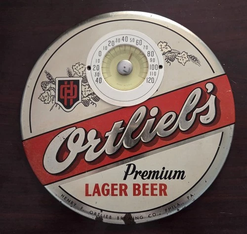 VINTAGE ORTLIEB BEER METAL TIN OVER CARDBOARD THERMOMETER BUTTON SIGN PHILA PA