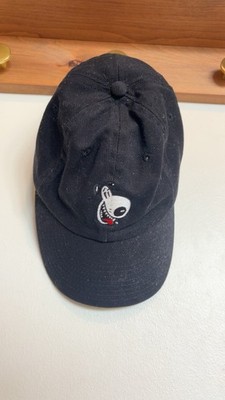 Black cap featuring a fun embroidered dog graphic on the front and  GET HAPPY! 