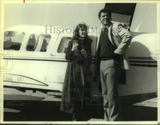 Press Photo Two Actors smile in scene near plane, Lou Grant, Jordan - sap14401