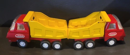 2 Vintage Mini-Tonka Dump trucks. Have been played with but in good shape. 5"x2"