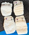 (4) 1998 Vintage Luvs PLASTIC Diapers Size 5 + Open Bag - Barney! — photo 3