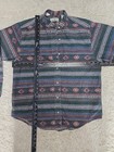Vintage LL Bean men’s L shirt with blue, red, and beige Aztec flannels, button-down front, and chest pocket.