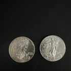 2014 and 2017 $1 American Silver Eagle Dollars - lot of 2 coins