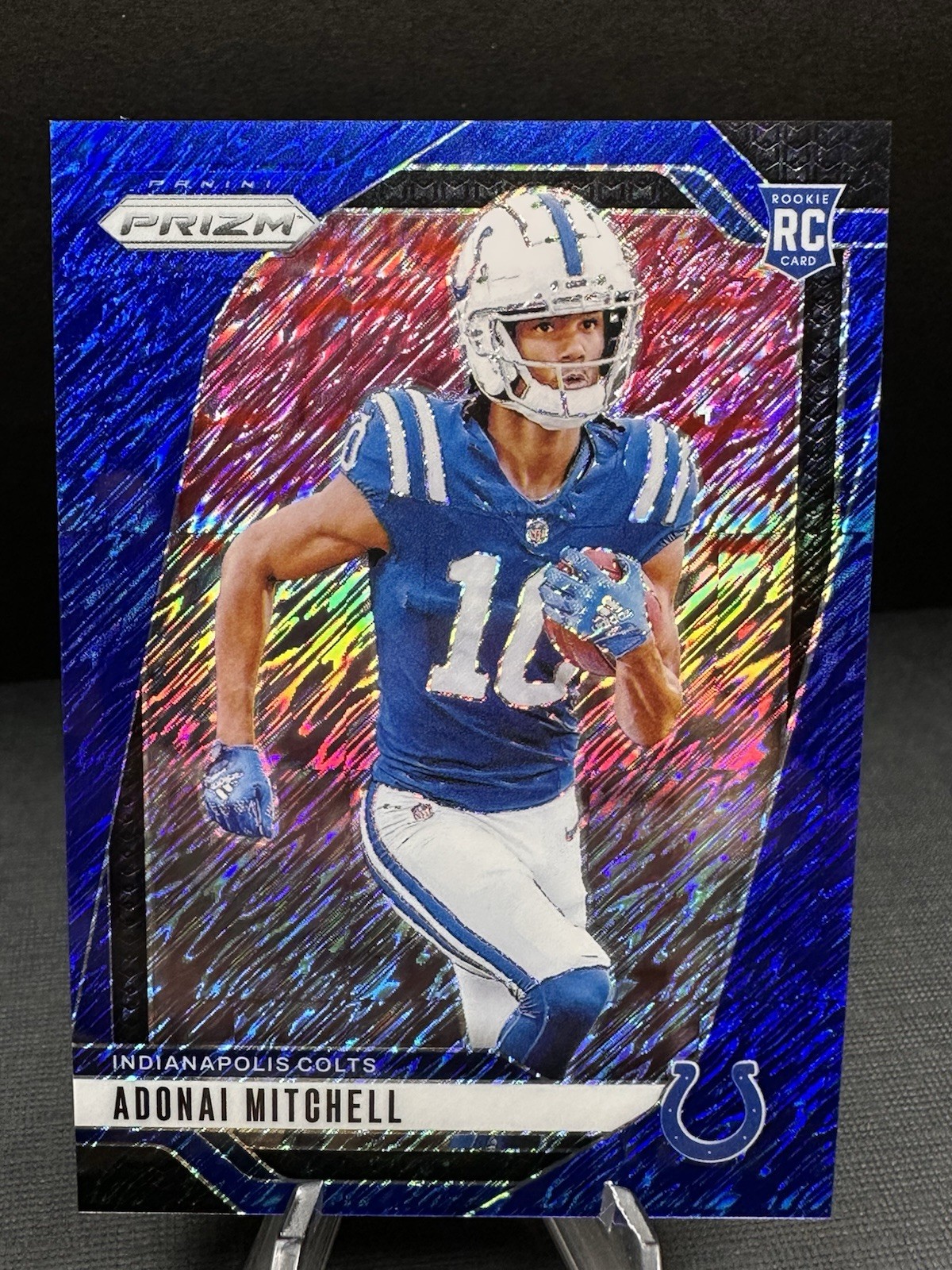 2024 Panini Prizm - Rookies Adonai Mitchell #303 Blue Shimmer Prizm /25 (RC)