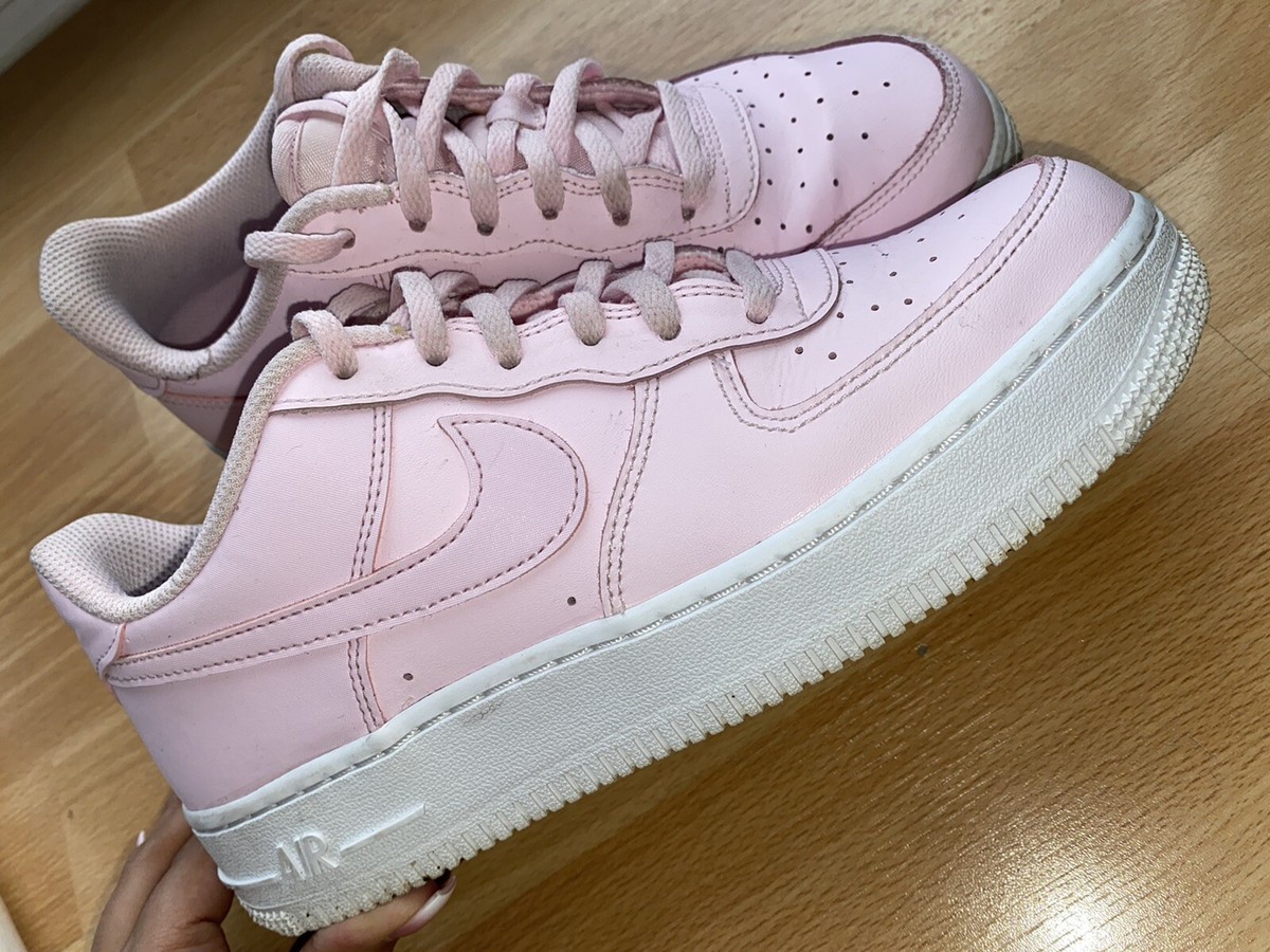 white nikes with pink soles