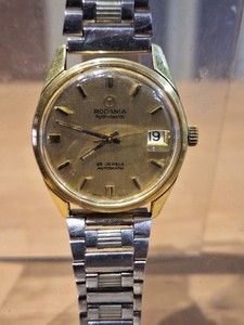 Montre Dame RODANIA Occasion - Cadran Blanc Chiffres Romains, Boîtier Doré Acier, Bracelet Noir - Fonctionne, Pile Neuve