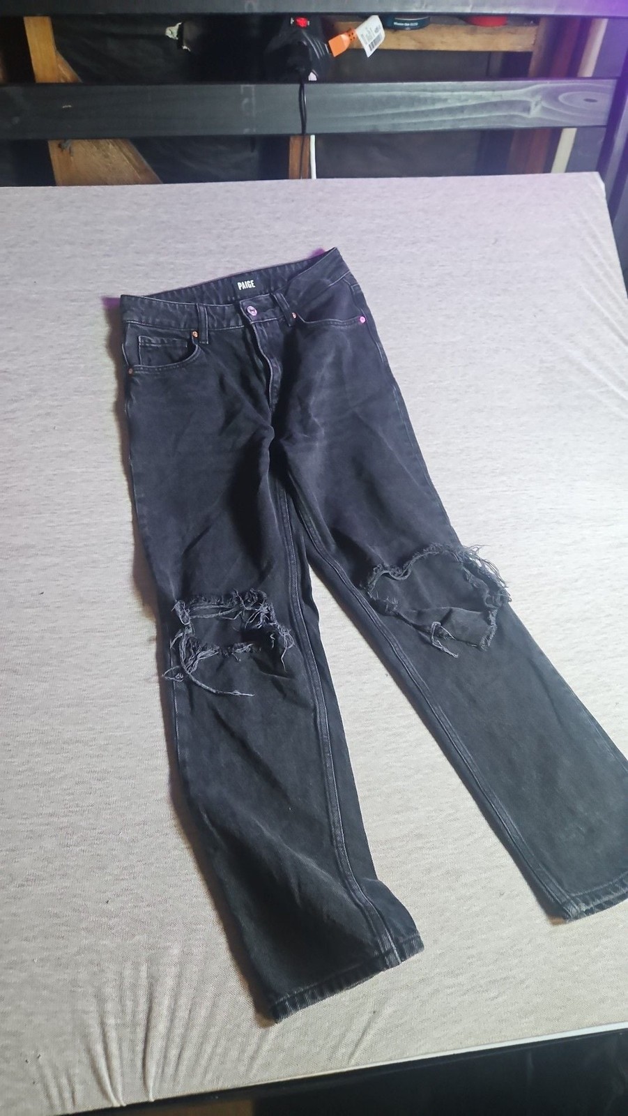 Paige frayed denim jeans with cut out...