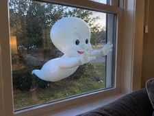 Casper the ghost through the window decoration