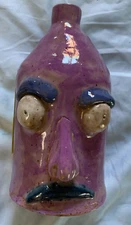  Face jug, purple pottery,  folk art 7''x4''  1 handle, no name, no chips.