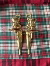 A Pair Of Single Arm Wall Mounted Brass Candle Stick Holders