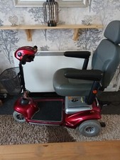 motability scooter used, shoprider,  red  needs battery 