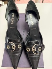 Prada Black Leather Pointed Toe Heels with Bu...