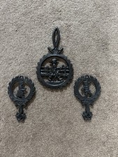 collection of 3 vintage cast iron trivets