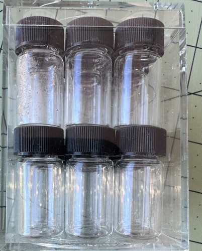 1 inch glass bottles in acrylic box  18 bottles total with lids