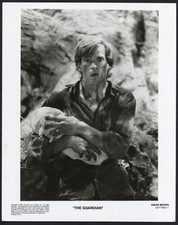 DWIER BROWN in The Guardian '90 HOLDING BABY