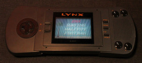Atari Lynx W. Game Cartridges, and  Carrying Case and power adapter AO4079462