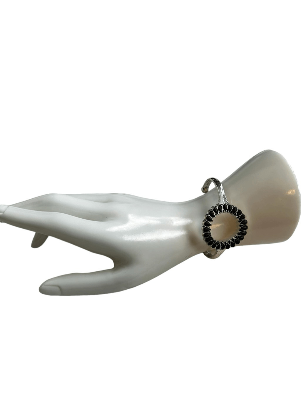 Silver and black open circle patterned cuff brace… - image 5