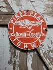 VINTAGE PIKES PEAK PORCELAIN SIGN OLD COLORADO OCEAN HIGHWAY ROCKY MOUNTAINS 12"