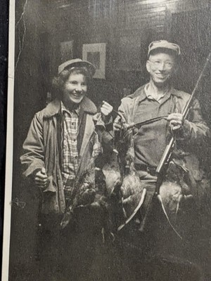 wonderful black and white snapshot of proud duck hunter and girl JA