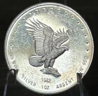 VINTAGE 1982 MONEX INTERNATIONAL LTD .999 FINE SILVER ART ROUND - SILVER EAGLE
