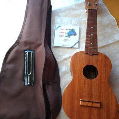 Ukulele with Case, Tuning Fork, Spare Strings
