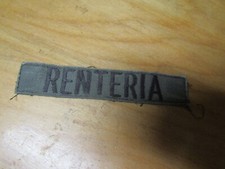 MILITARY PATCH OLDER COMBAT USED NAME TAPE SEW ON SUBDUED WITH NAME RENTERIA
