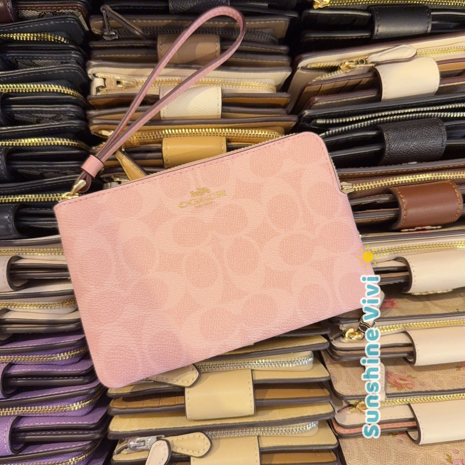 Bracciale Coach con zip angolare nuovo con etichette in tela firmato CAQ75 IM rosa cipria