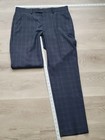 Blue Ralph Lauren men’s dress pants with small black plaid pattern, flat front, size 32W x 30L, laid flat on light wood floor.