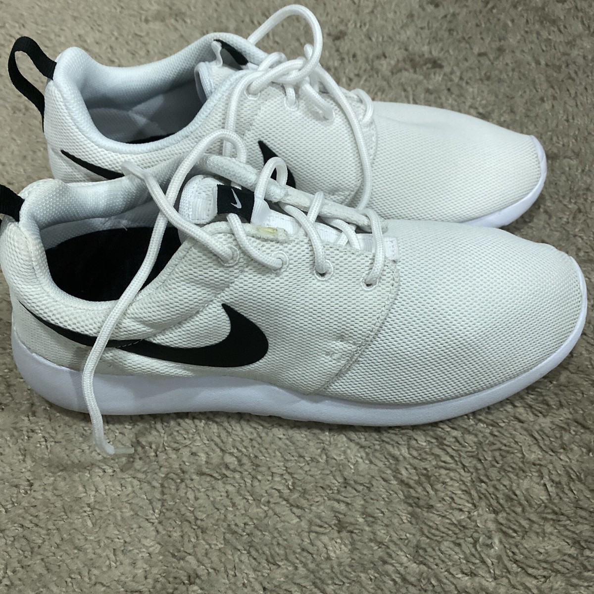 white roshes with black swoosh