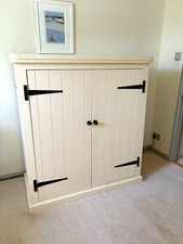 This a bespoke painted wardrobe which holds a huge amount.