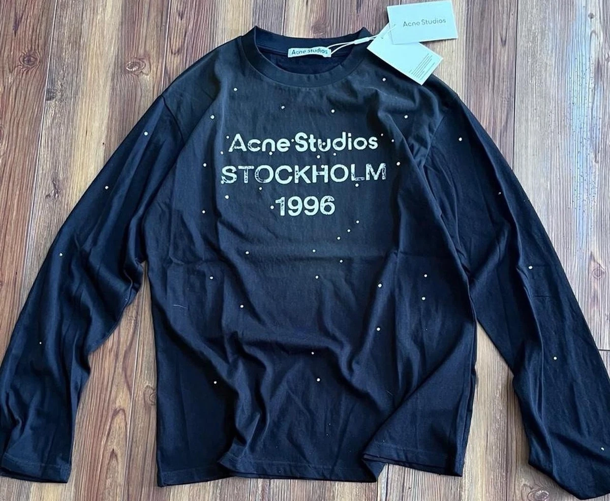 Preços baixos em Camisetas masculinas de algodão sólido Acne