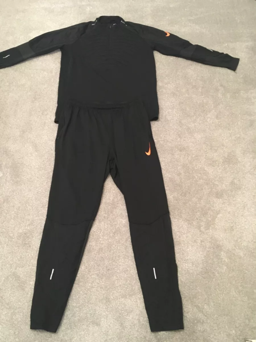 Nike black top and orange tracksuit