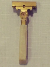 Vintage Schick Eversharp razor, brass with  white ribbed handle, nice shape 