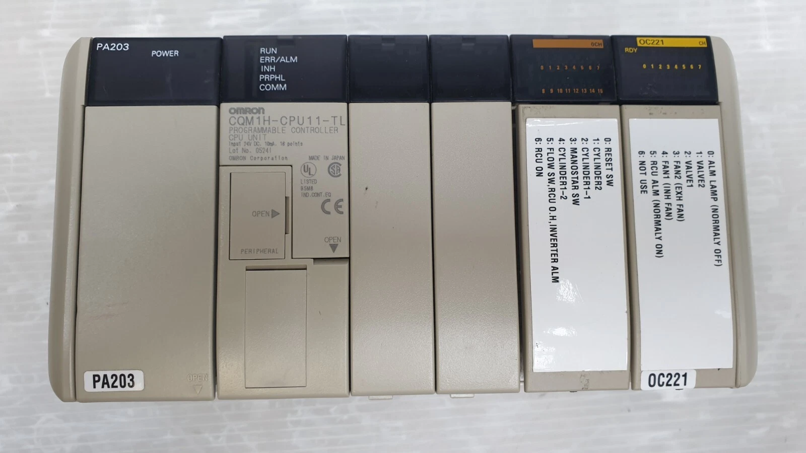 Front of the CQM1H-CPU11-TL CPU, 0CH input section and OC221 output with hand-written signal labels