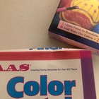 White vintage PAAS Egg Color Set box with glitter patch instructions, pink/purple cake mix, and colorful sprinkles.