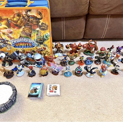 Skylanders Giants Characters with platform and storage case.