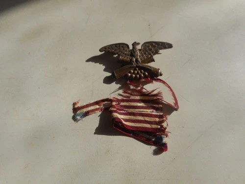 U.S. Brass Civil War Pin with tattered Ribbon