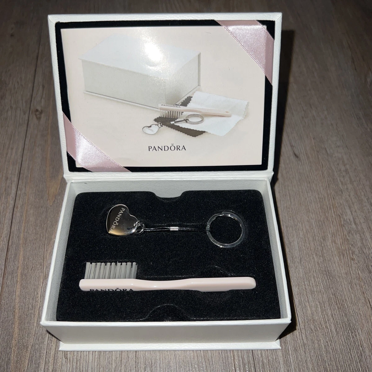 LOT:419  Pandora cleaning kit, with key ring and brush, two silver