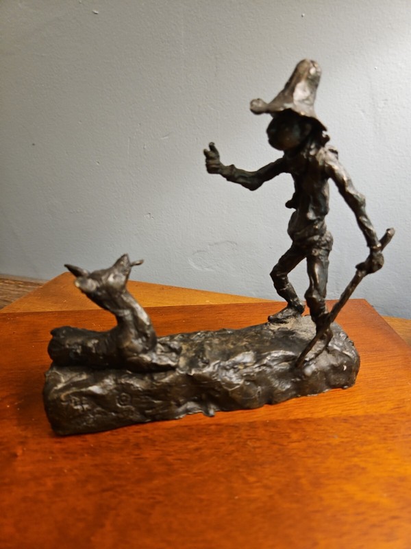Bronze wildlife deer / hunter. B. Holgren  74. Trails   Big Pete tangles tongues