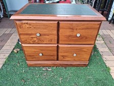 Smart-looking wooden cabinet with 4 large drawers and leather inlaid top.