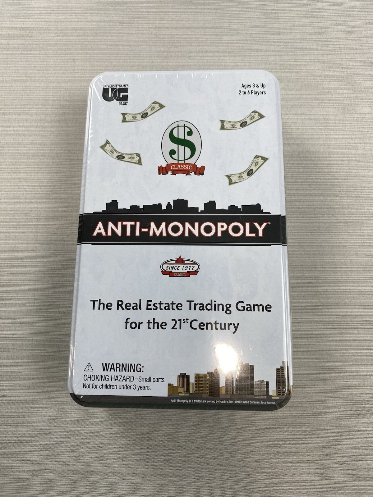 Anti-Monopoly Game Travel Tin Ages 8+ | 2-6 players University Games - Sealed