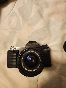 Canon T50 Black 35mm SLR Film Camera Body with Canon Zoom Lens Attached