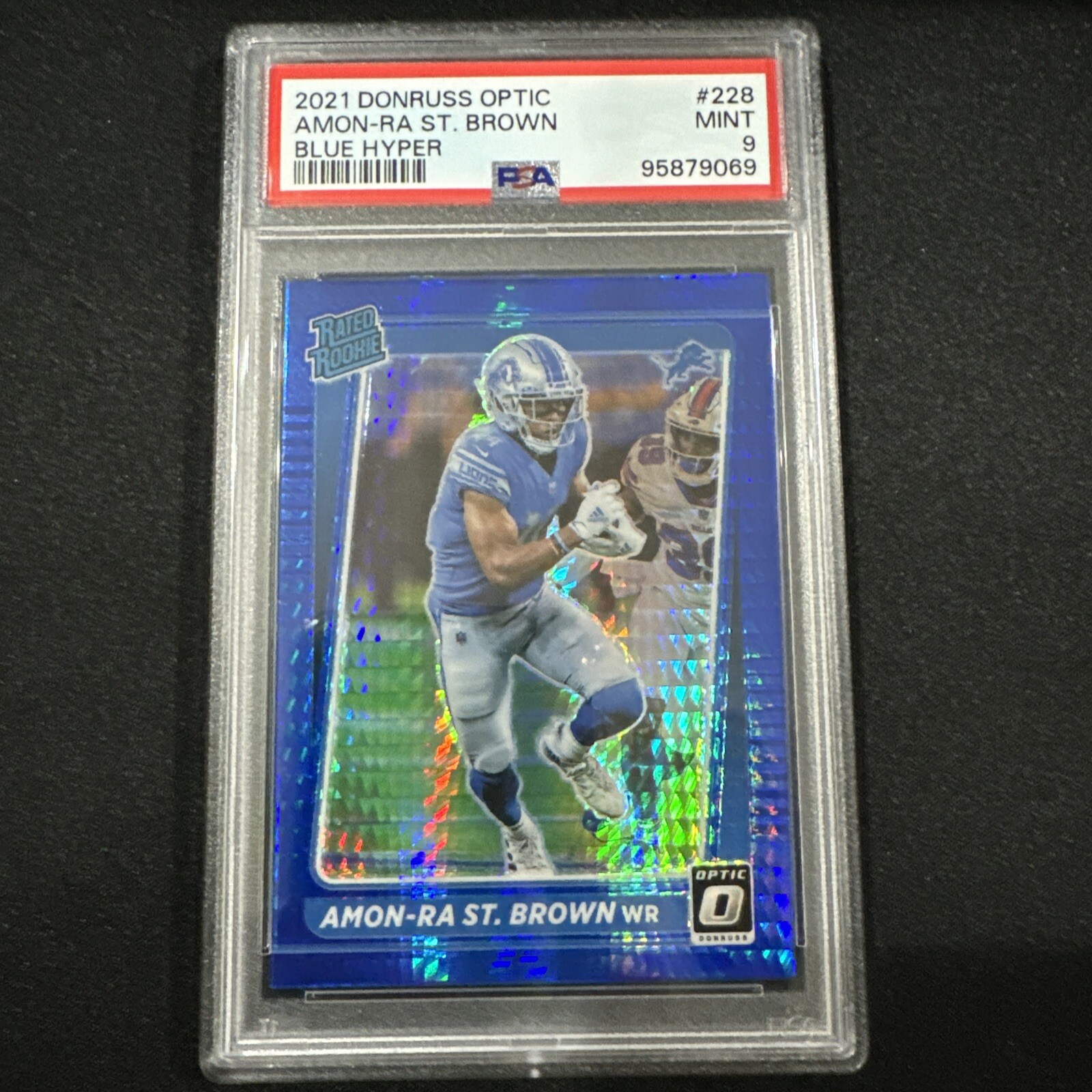 2021 Donruss Optic - Rated Rookie Blue Hyper  #228 Amon-Ra St. Brown (RC) PSA 9