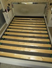 King Size upholstered bed frame with a fabric headboard and mirrored accents