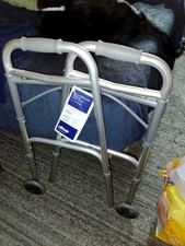 Drive 102101 Deluxe Two Button Folding Walker with 5 inch Wheels - Silver